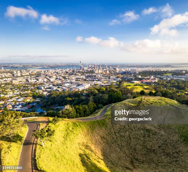 auckland's skyline over mount eden - auckland stock pictures, royalty-free photos & images