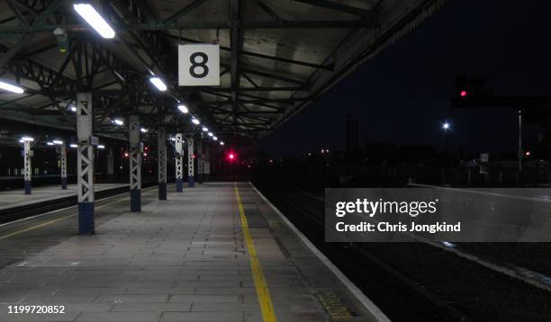 empty railway station platform at night - railroad station platform stock pictures, royalty-free photos & images