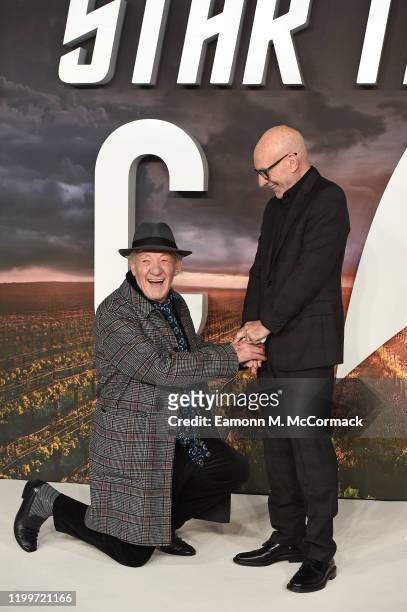 Ian McKellen gets down on one knee for Sir Patrick Stewart on the red carpet during the "Star Trek Picard" UK Premiere at Odeon Luxe Leicester Square...