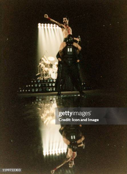 Lead singer of Queen, Freddie Mercury , sits on the shoulders of Star Wars character Darth Vader during The Game Tour, September 20 at Joe Louis...