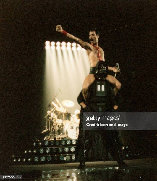 Lead singer of Queen, Freddie Mercury , sits on the shoulders of Star Wars character Darth Vader during The Game Tour, September 20 at Joe Louis...