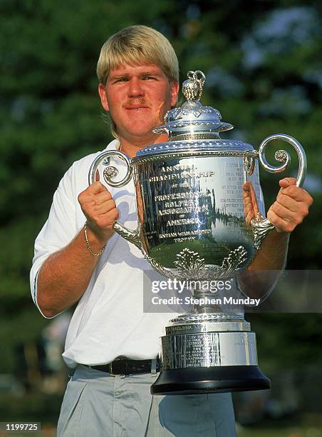 John Daly of the USA holds the trophy after winning the USPGA Championship at Crooked Stick in Carmel, Indiana, USA in August 1991.