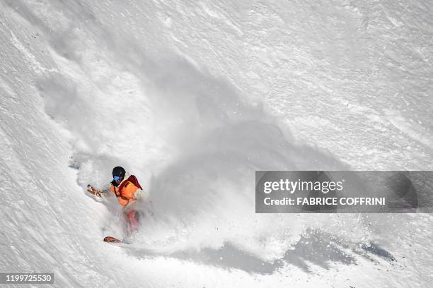 This image taken on February 7, 2020 shows freeride snowborder Elias Elhardt of Germany competing during the Men's snowboard event of the second...