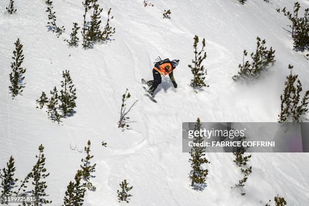 This image taken on February 7, 2020 shows freeride snowborder Craig McMorris of Canada competing during the Men's snowboard event of the second...