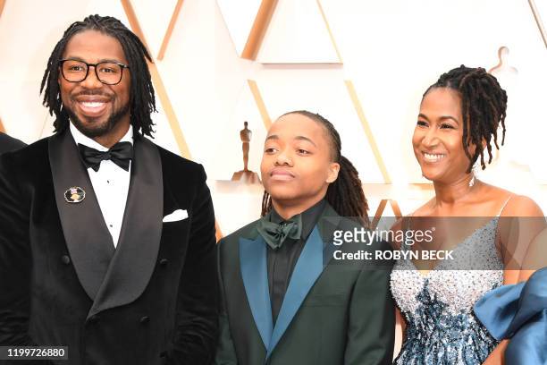 Director Matthew A. Cherry , US producer Karen Rupert Toliver and Deandre Arnold , the Texas teen who was told his dreadlocks violated school dress...