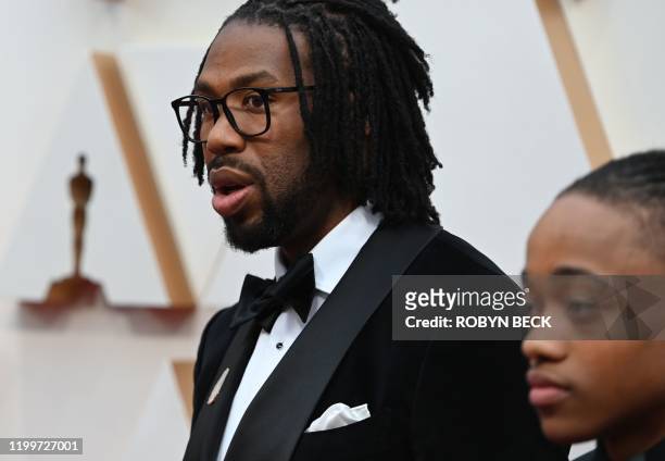 Director Matthew A. Cherry and Deandre Arnold, the Texas teen who was told his dreadlocks violated school dress code, arrive for the 92nd Oscars at...