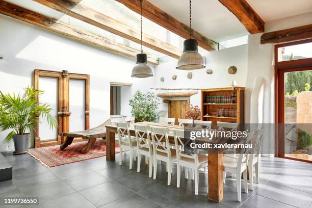 dining area in refurbish a spanish farmhouse - rustic dining room stock pictures, royalty-free photos & images