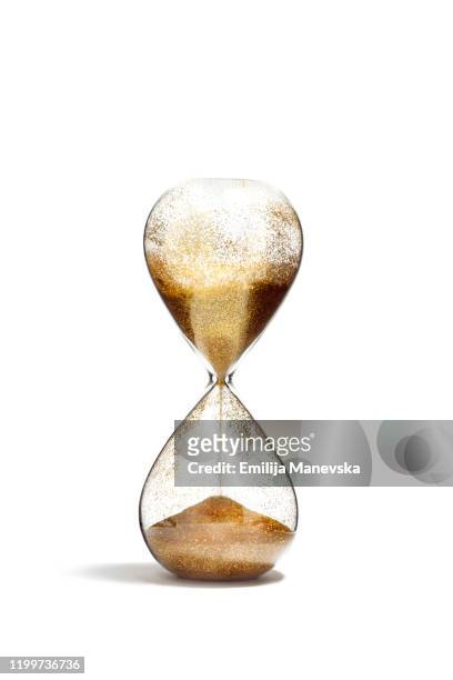 hourglass with golden sand on white background - now defunct stock pictures, royalty-free photos & images