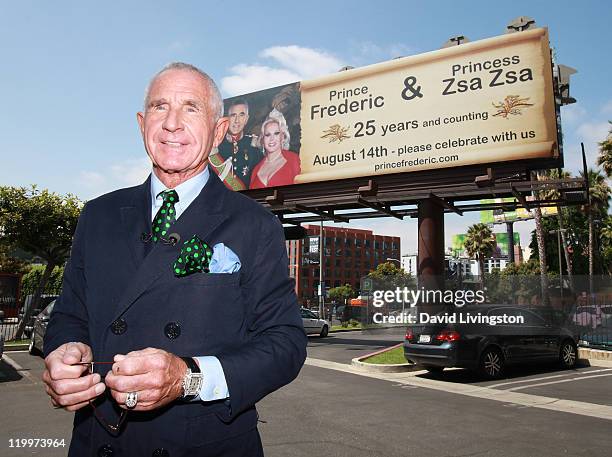 Prince Frederic von Anhalt poses at a 44-foot high billboard on Sunset Blvd celebrating 25 years of marriage to his wife Zsa Zsa Gabor on July 27,...
