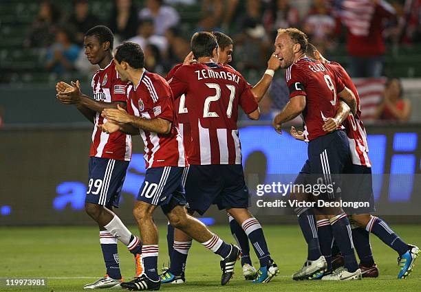 Ben Zemanski, Simon Elliott, Heath Pearce, Zarek Valentin and Francisco Mendoza of Chivas USA celebrate with teammate Nick LaBrocca and Victor...