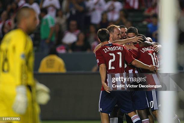 Ben Zemanski, Simon Elliott, Heath Pearce, Zarek Valentin and Francisco Mendoza of Chivas USA celebrate with teammate Nick LaBrocca after LaBrocca's...