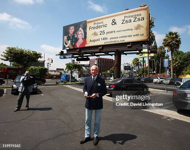 Prince Frederic von Anhalt poses at a 44-foot high billboard on Sunset Blvd celebrating 25 years of marriage to his wife Zsa Zsa Gabor on July 27,...