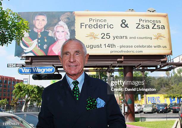 Prince Frederic von Anhalt poses at a 44-foot high billboard on Sunset Blvd celebrating 25 years of marriage to his wife Zsa Zsa Gabor on July 27,...