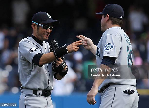 Ichiro Suzuki of the Seattle Mariners celebrates the win with Jack Cust against the New York Yankees on July 27, 2011 at Yankee Stadium in the Bronx...