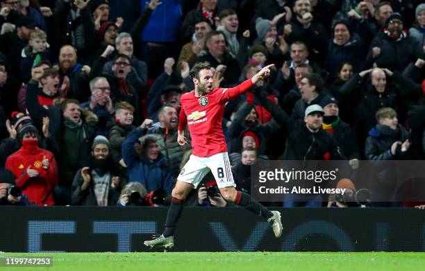 Juan Mata of Manchester United celebrates after scoring his team's first goal during the FA Cup Third Round Replay match between Manchester United...