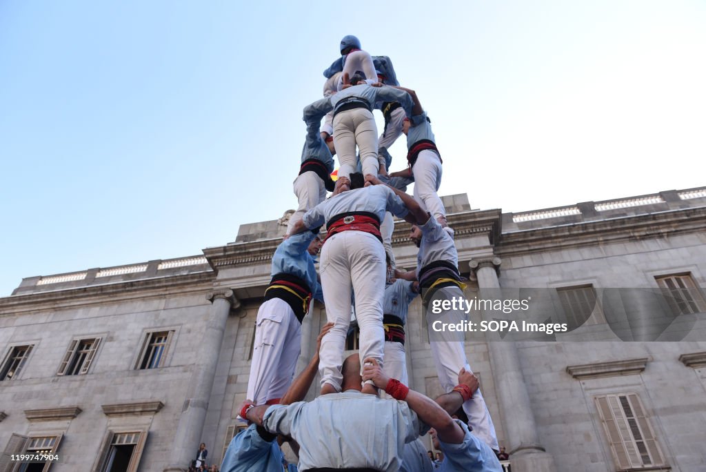 Castellers form a castel, a human tower, seen during the...