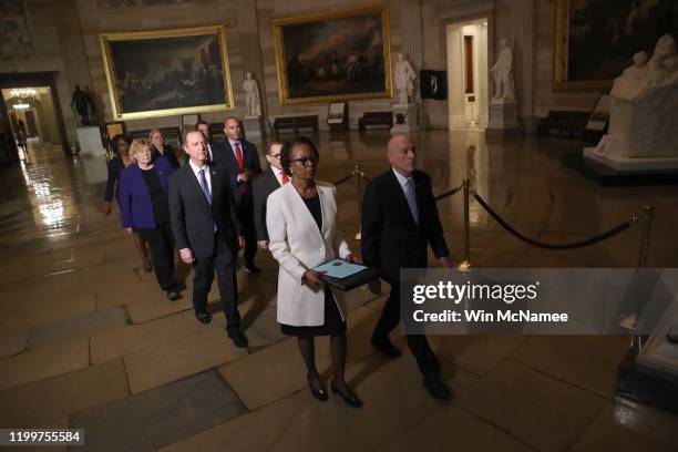 Articles of Impeachment against U.S. President Donald Trump are formally carried through the Rotunda of the U.S. Capitol by officials from the U.S....