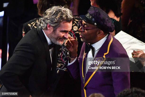 Actor Joaquin Phoenix and US director Spike Lee chat ahead of the 62nd Annual Grammy Awards on January 26 in Los Angeles.