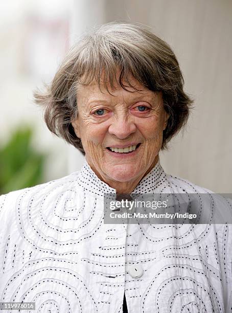 Dame Maggie Smith accompanies Prince Charles, Prince of Wales and Camilla, Duchess of Cornwall as they visit the 130th Sandringham Flower Show on...