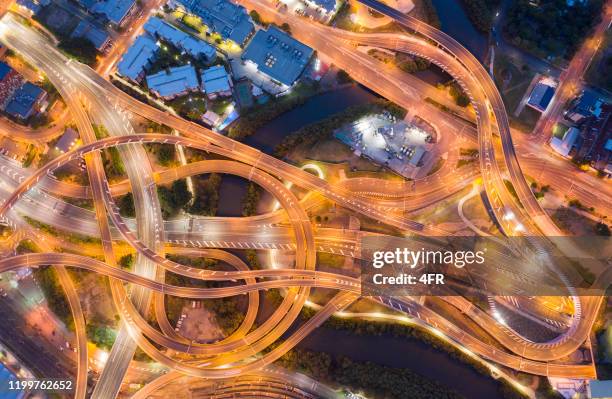 highway junction intersection and railroad tracks, brisbane, australien - australian bus driver stock-fotos und bilder