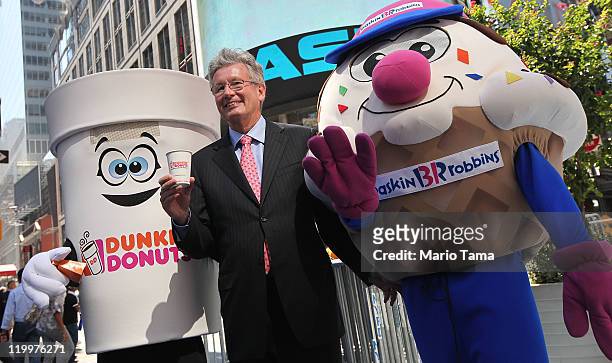 Dunkin' Brands Group President and CEO Nigel Travis, the parent company of Dunkin' Donuts and Baskin-Robbins, celebrates their initial public...