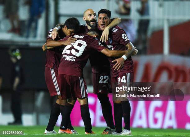 Enzo Perez of River Plate celebrates with teammates Javier Pinola, Robert Rojas and Gonzalo Montiel after winning a match between Union and River...