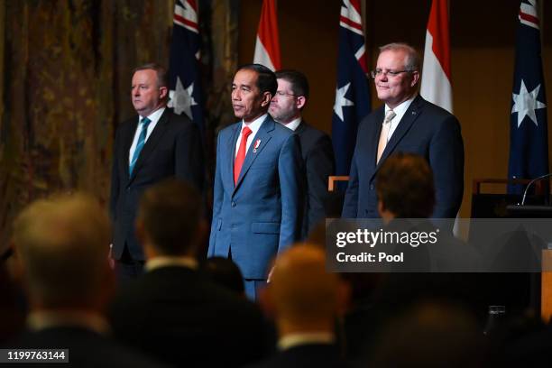 Australian Opposition Leader Anthony Albanese, Indonesian President Joko Widodo and Australian Prime Minister Scott Morrison attend an official...