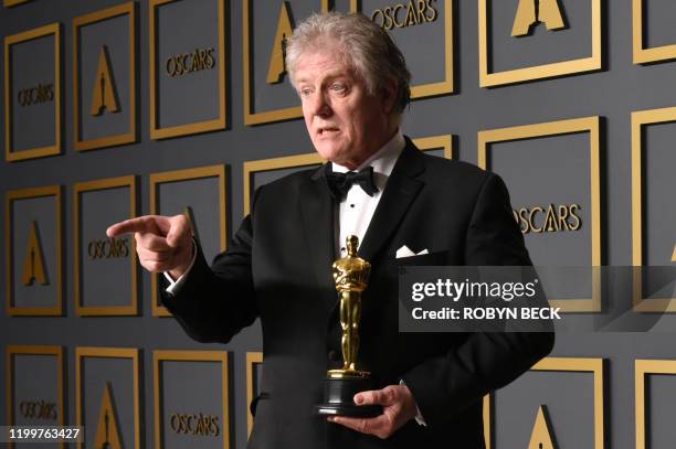 Sound engineer Donald Sylvester poses in the press room with the Oscar for Best Sound Editing for "Ford v Ferrari" during the 92nd Oscars at the...