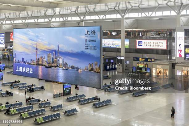 Passengers wait in the departure hall of Hongqiao Highspeed Railway Station in Shanghai, China on Sunday, Feb. 9, 2020. Most Chinese provinces and...