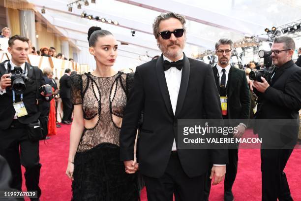 Actor Joaquin Phoenix and US actress Rooney Mara arrive for the 92nd Oscars at the Dolby Theatre in Hollywood, California on February 9, 2020.