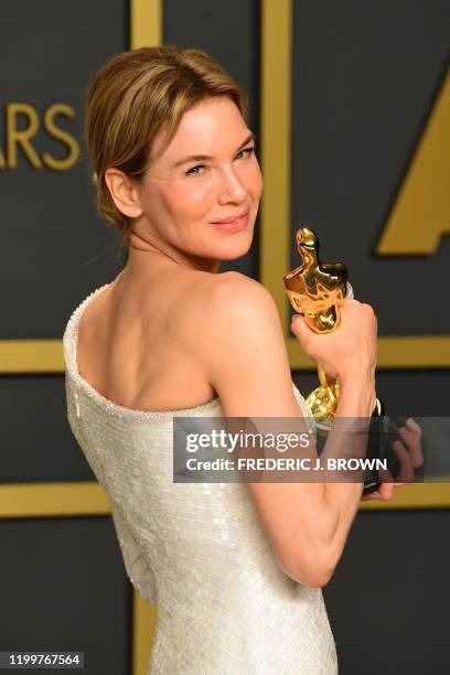 Actress Renee Zellweger poses in the press room with the Oscar for for Best Actress for "Judy" during the 92nd Oscars at the Dolby Theater in...