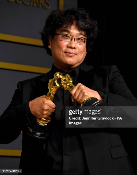 Bong Joon-ho with his Oscars for Best Director and Best Picture for Parasite in the press room at the 92nd Academy Awards held at the Dolby Theatre...