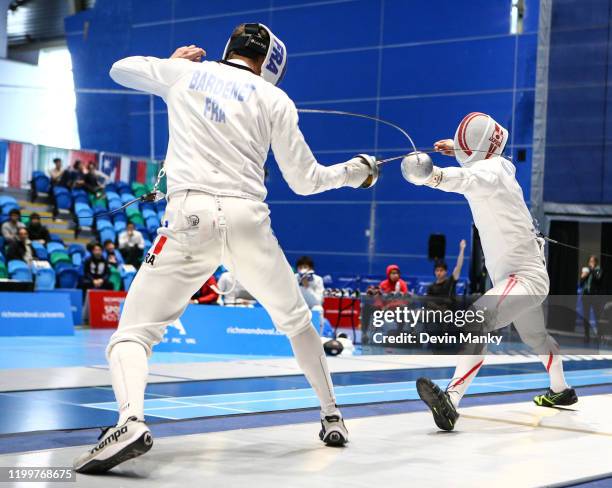 Kazuyasu Minobe of team Japan fences Alexandre Bardenet of France fence during the bronze medal match team competition at the Peter Bakonyi Men's...