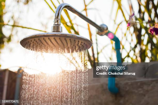 outdoor rain shower,shower with nature - close up of a cleansing spray nozzle stockfoto's en -beelden