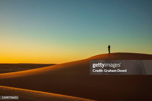 sunset in outback queensland - wide angle people stock pictures, royalty-free photos & images