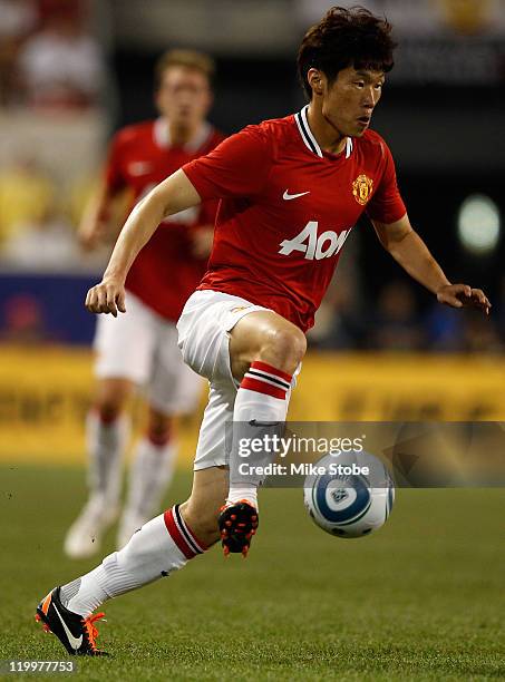 Ji-Sung Park of the Manchester United runs the ball against the MLS All-Stars during the MLS All-Star Game at Red Bull Arena on July 27, 2011 in...