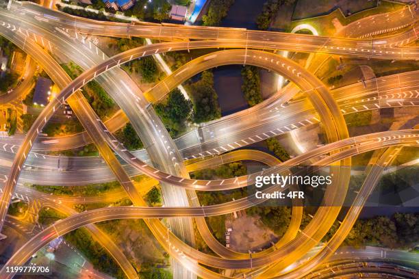 highway junction intersection and railroad tracks, brisbane, australien - australian bus driver stock-fotos und bilder