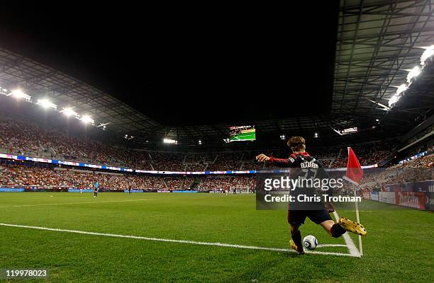 David Beckham of the MLS All-Stars shoots a corner kick against the Manchester United during the first half of the MLS All-Star Game at Red Bull...
