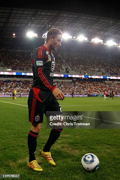 David Beckham of the MLS All-Stars prepares to shoot a corner kick against the Manchester United during the first half of the MLS All-Star Game at...