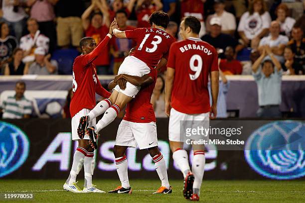 Ji-Sung Park of the Manchester United celebrates his goal in the forty-fifth minute with teammates against the MLS All-Stars during the MLS All-Star...