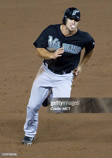 Florida Marlins right fielder Bryan Petersen runs the bases while blowing a bubble against the Washington Nationals during the eight inning at...