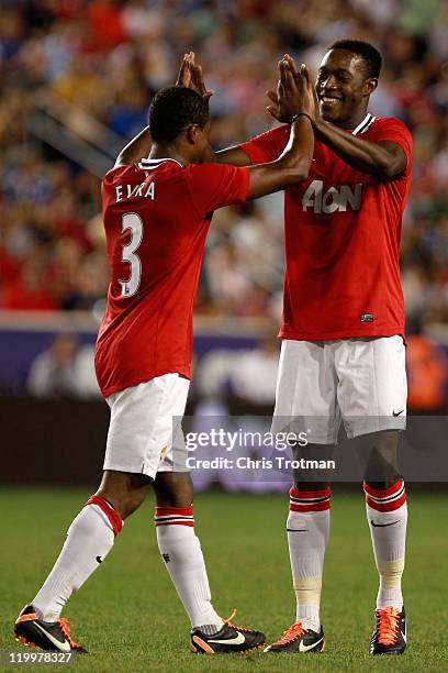 Danny Welbeck of the Manchester United celebrates his goal against the MLS All-Stars with teammate Patrice Evra during the second half of the MLS...