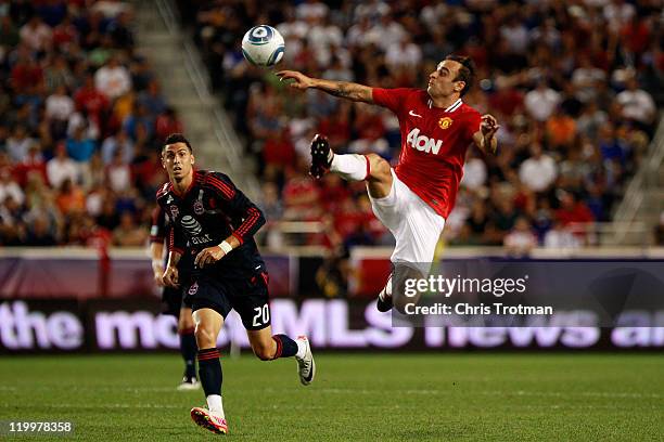 Dimitar Berbatov of the Manchester United controls the ball against Geoff Cameron of the MLS All-Stars during the second half of the MLS All-Star...