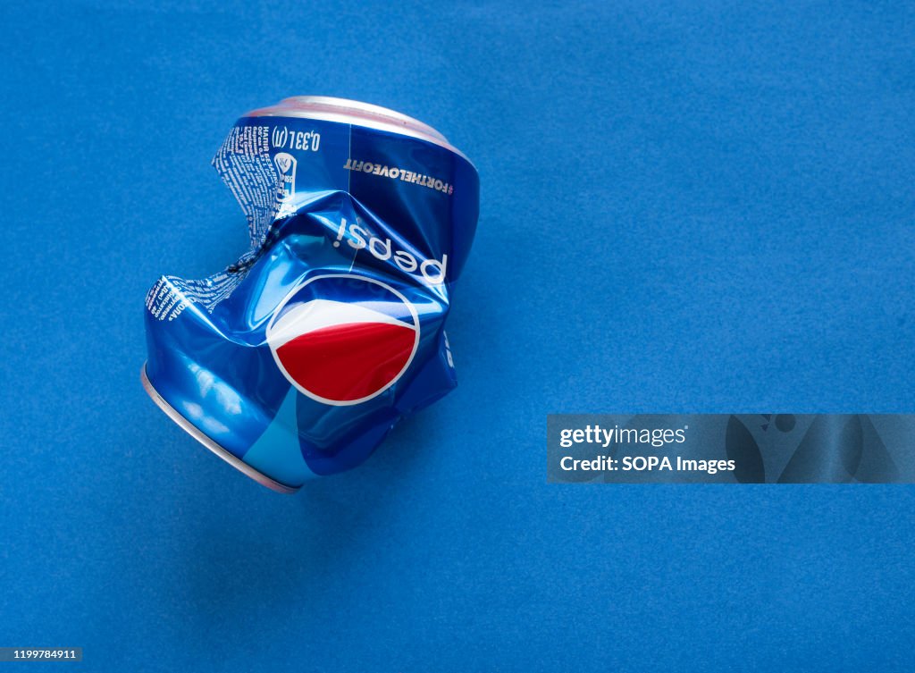 In the photo illustration a crumpled Pepsi aluminium can...