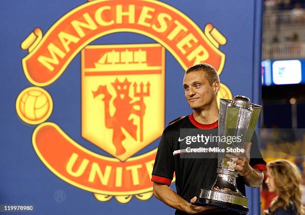 Nemanja Vidic of the Manchester United celebrates with the trophy after defeating the MLS All-Stars 4-0 during the MLS All-Star Game at Red Bull...