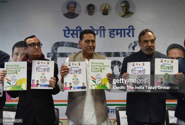 Delhi Pradesh Congress Committee president, Subhash Chopra along with Ajay Maken and Anand Sharma while releasing the Congress manifesto for Delhi...