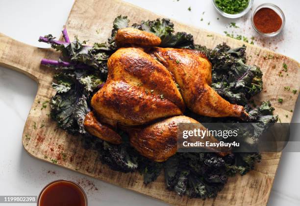 butterflied roast chicken - rotisserie stock pictures, royalty-free photos & images