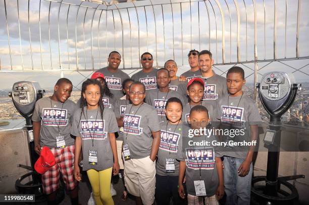 Yankees CC Sabathia, Mike Harkey, Tony Pena, Freddy Garcia, and Jorge Posada, along with Haitian school children fron the Ss. Joachim and Anne's...