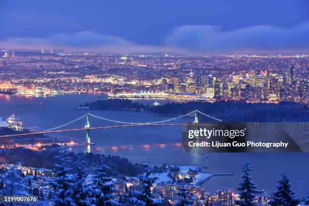 lions gate bridge and downtown vancouver in winter with snow, viewed from cypress mountain - vancouver lions gate stock pictures, royalty-free photos & images