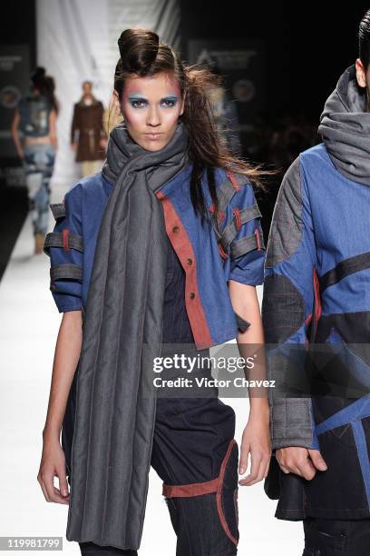 Model walks the runway during the Fundacion Universitaria Del Area Andina show on day two of Colombiamoda 2011 at Plaza Mayor on July 26, 2011 in...